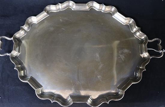 A George V silver two handled shaped oval silver tea tray, Thomas Bradbury & Sons, London, 1924, 63 oz.